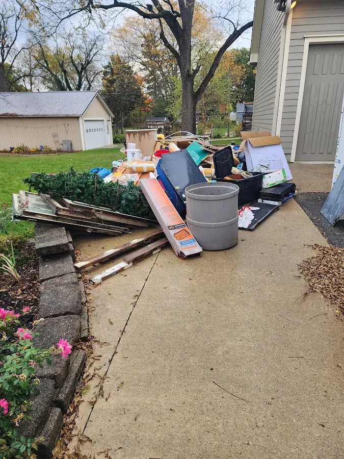Dumpster being loaded with debris for 30 Yard Dumpster Rental in Clemson